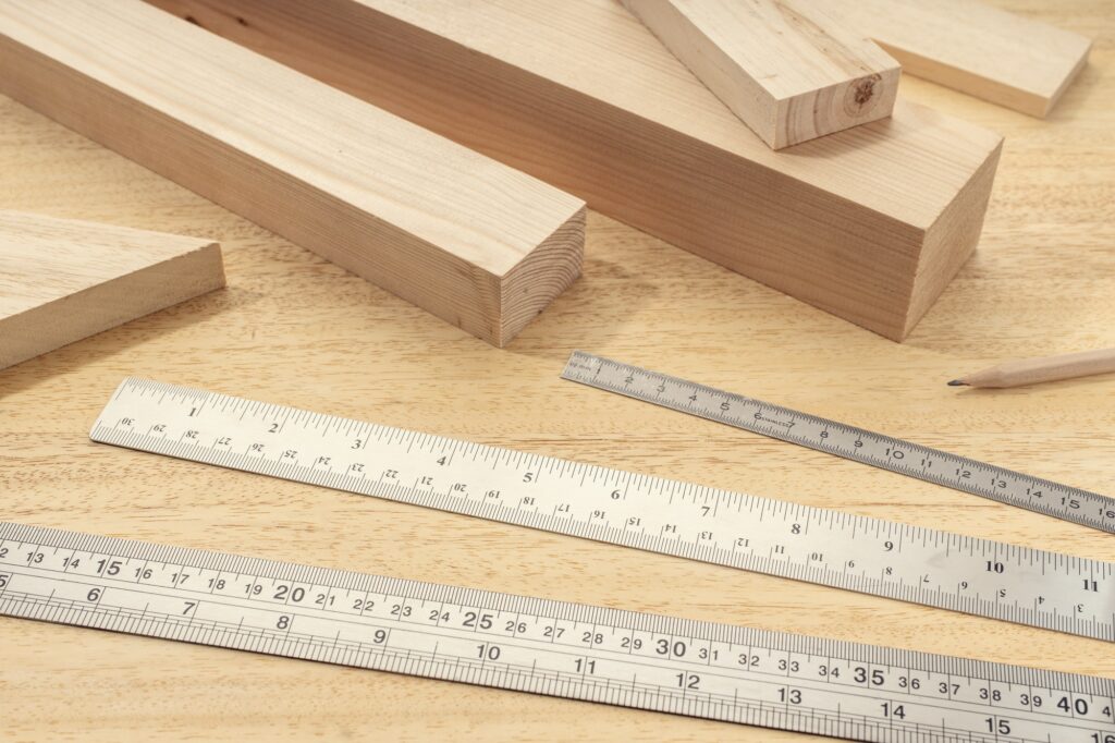 Group of assorted Wood material with professional rulers